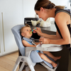Mom feeding infant in the Inglesina MyTime High Chair in Sugar