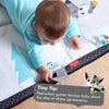 Baby playing on the Tiny Love Magical Tales Black & White Super Mat
