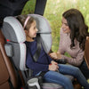 Girl sitting in the UPPAbaby ALTA Booster Car Seat in Sasha