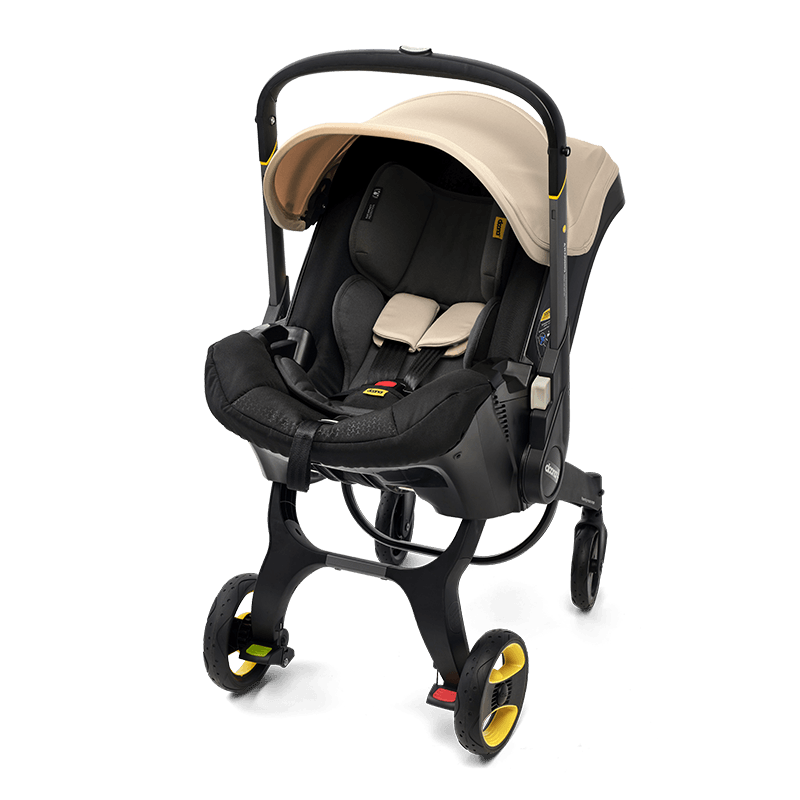 Doona™ Infant Car Seat/Stroller + Base in Sahara Sand