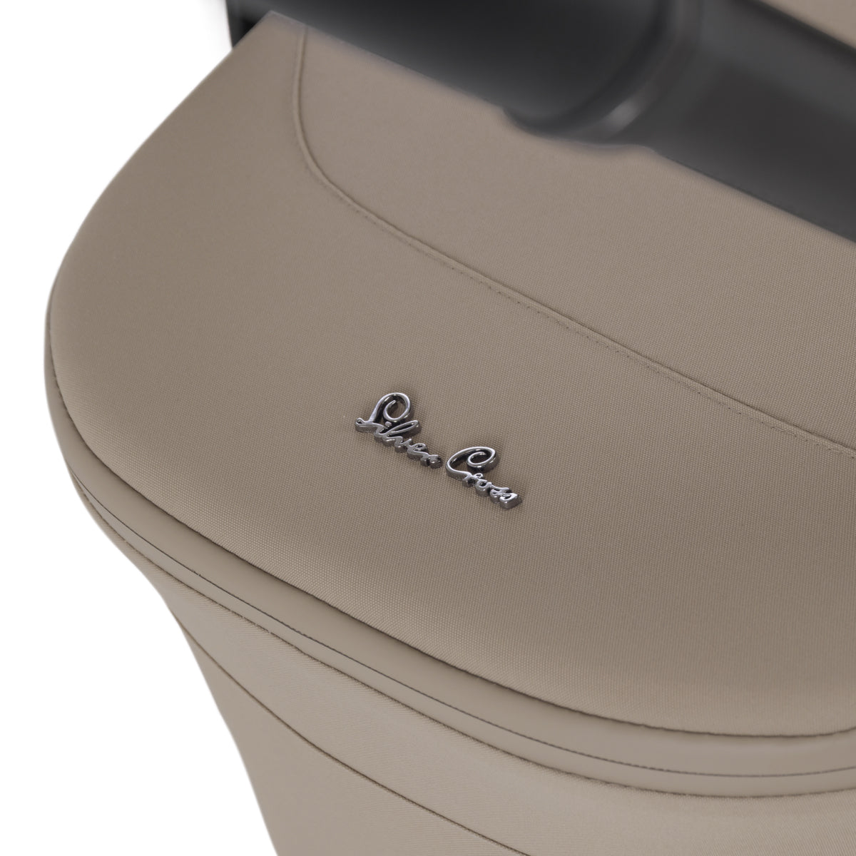 Close-up of a beige car seat with 'Silver Cross' branding on a white background