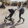 Mom pushing the  Baby Jogger City Mini GT2 stroller