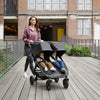 Mom pushing Baby Jogger City Mini® GT2 Double Stroller in Jet