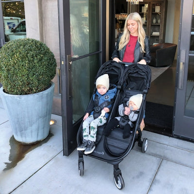 Mom pushing the Baby Jogger 2019 City Tour 2 Double Stroller