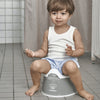 Little boy sitting on the BABYBJÖRN Smart Potty
