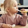 Child eating with the BABYBJÖRN Baby Spoon & Fork