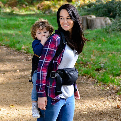 Mom carrying baby in the Diono Carus Essentials 3-in-1 Baby Carrier