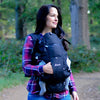 Mom carrying baby in the Diono Carus Essentials 3-in-1 Baby Carrier