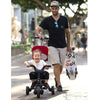 Child and father with the Doona™ Liki Trike S5 in Nitro Black