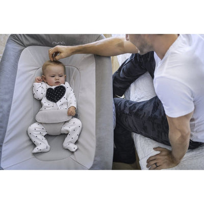 Nuna COVE™ Aire Travel Crib in Frost with baby inside