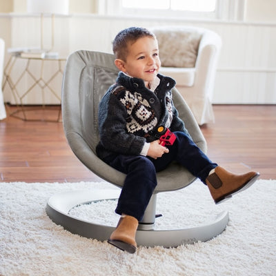 Toddler sitting in the Nuna LEAF grow Baby Seat in Oxford