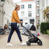 Mom pushing baby in the Nuna PEPP Next Stroller in Frost