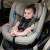 Baby sitting in the Nuna REVV™ Rotating Convertible Car Seat in Hazelwood