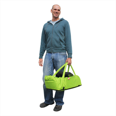 Dad carrying the Phil&teds Cocoon Carrycot in Apple