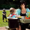 Toddler sitting in the Phil&teds Lobster Portable High Chair in Black at the table