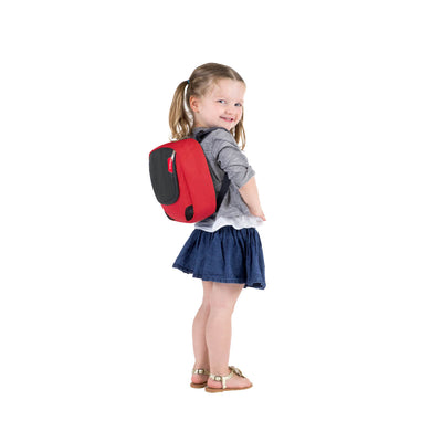 Little girl wearing small backpack from the Phil&teds Parade Backpack Baby Carrier