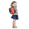 Little girl wearing small backpack from the Phil&teds Parade Backpack Baby Carrier