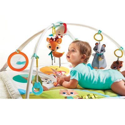 Baby playing on the Tiny Love Into the Forest™ Gymini® Deluxe