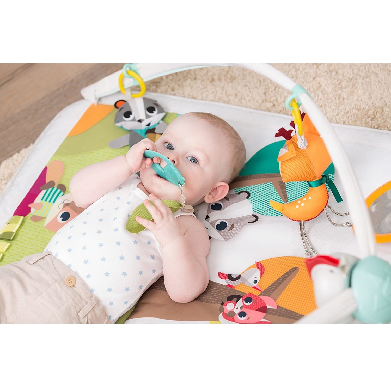 Baby playing with Tiny Love Into the Forest™ Gymini® Deluxe