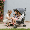 Mom with two daughters in the UPPAbaby G-LINK 2 Double Stroller