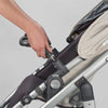 UPPAbaby SnackTray being attached by bumper bar